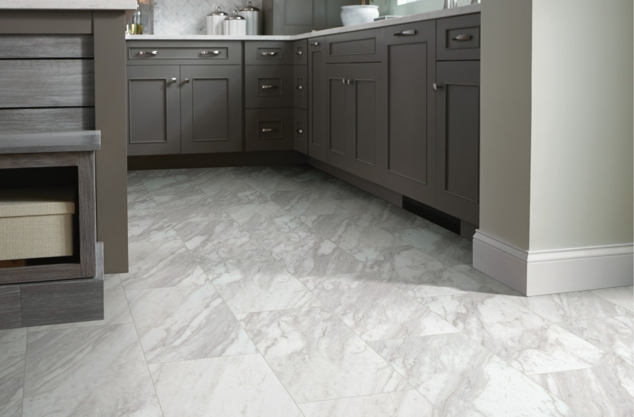 Gray cabinetry paired with Shaw Paragon Tile Plus 12