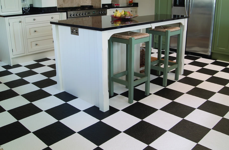 FlooringInc 2020 flooring trends: black and white flooring in a kitchen setting.