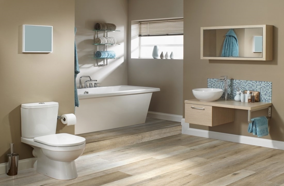 2021 Bathroom Flooring Trends: Blond wood-look vinyl planks in a bathroom setting