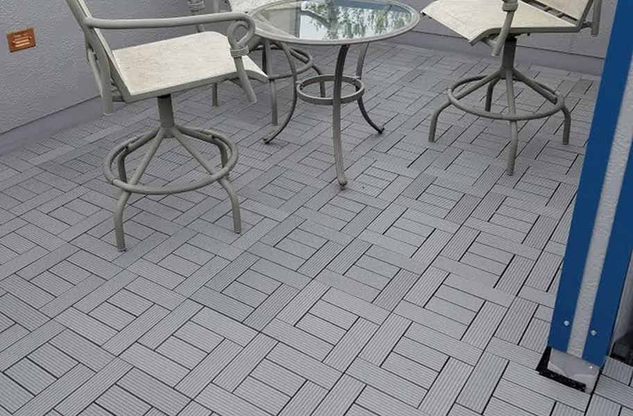 Helios Deck Tiles in outdoor setting with table and chairs